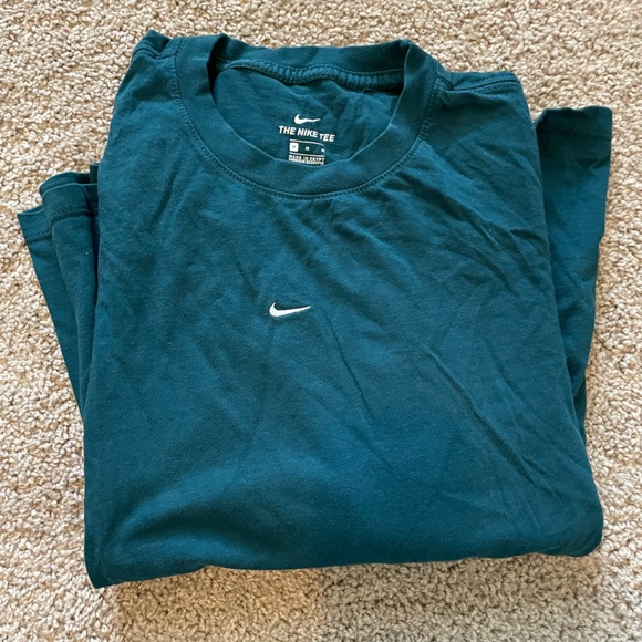 Teal Nike long sleeve tshirt with black and white Nike pattern down the sleeves - Picture 1 of 2